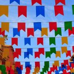 Pula,Sardinia, Italy: street covered in colorful banners – bunting