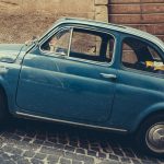 Vintage italian blue car on cobbled street