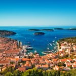 Harbor of old Adriatic island town Hvar. High angle panorama.