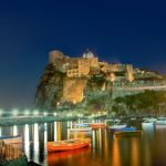 Ancient hotel and castle in Ischia island, Italy, at night